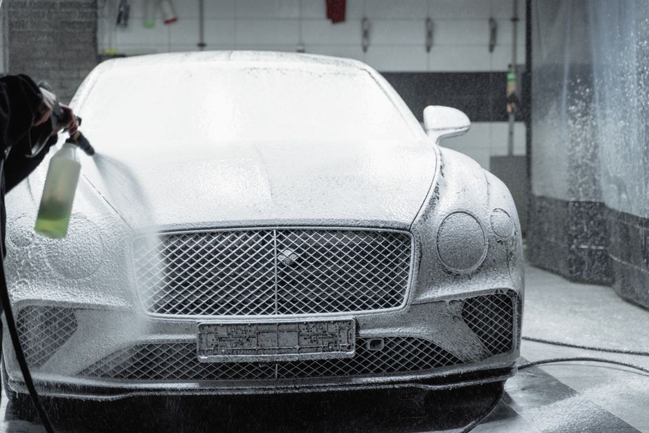 High-pressure foam wash being applied to a fleet vehicle